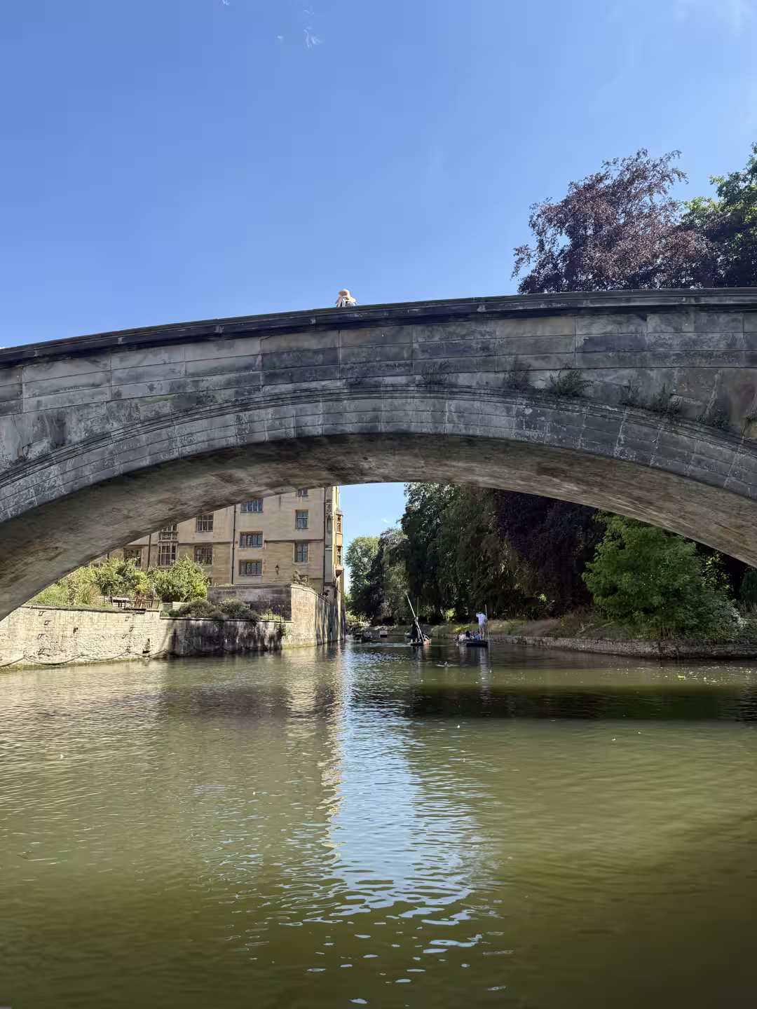 A stone bridge over the River Cam on the Cambridge College Backs